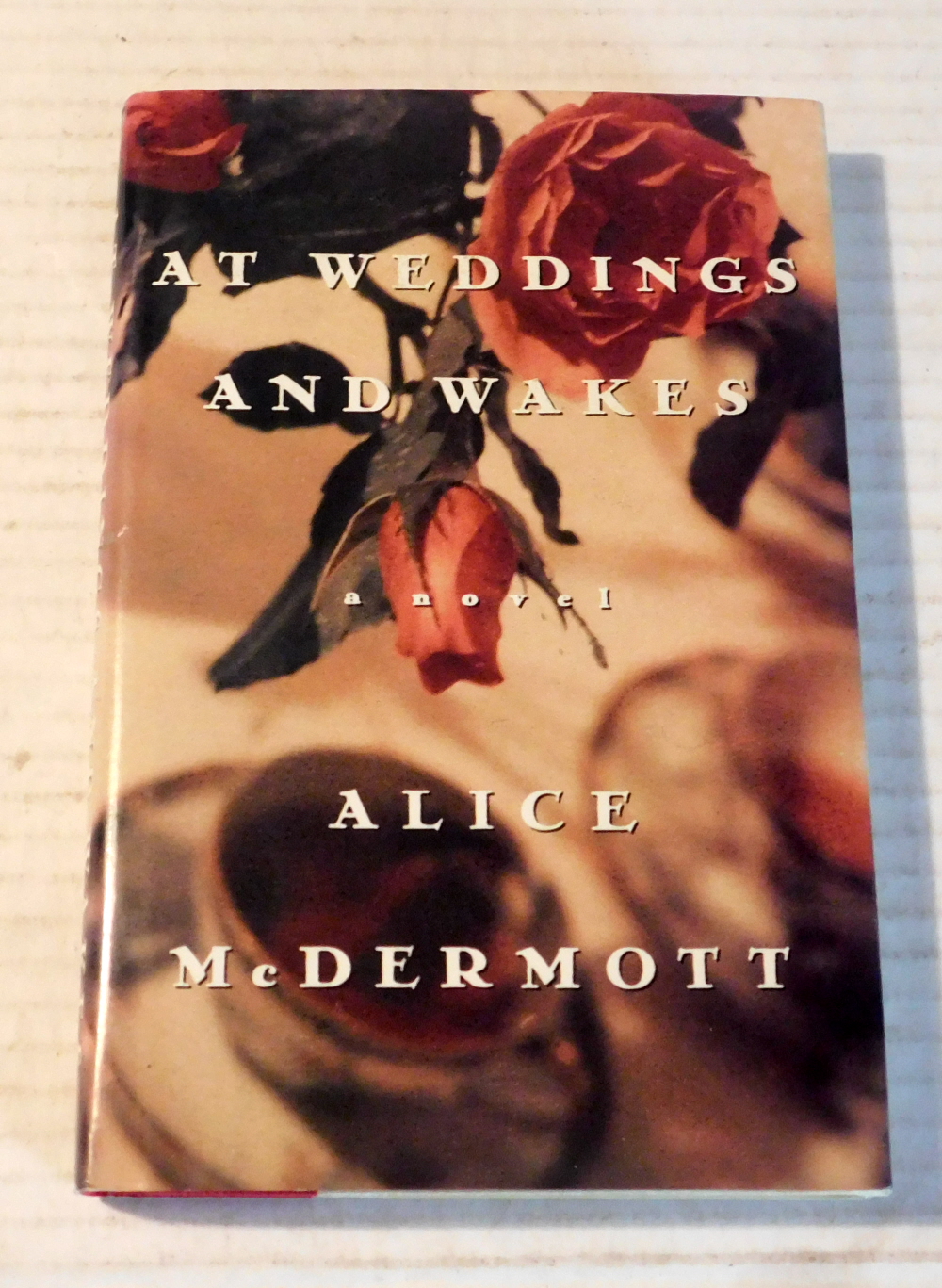 AT WEDDINGS AND WAKES. [SIGNED by ALICE McDERMOTT].